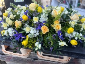 Spring yellow and purple casket spray
