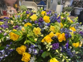 Yellow, Blue and Purple Casket Spray